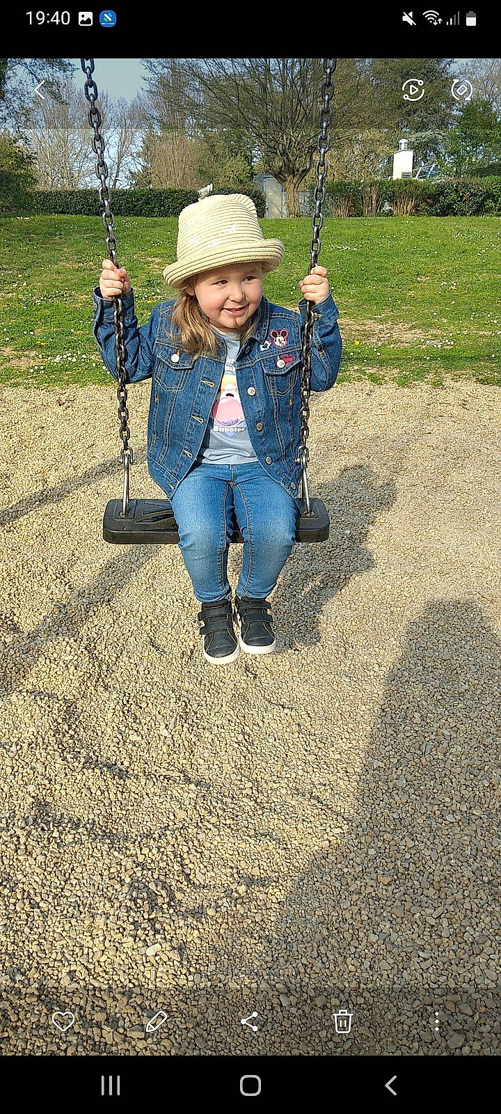 Myléna participe au concours pour gagner de l'argent avec cette photo : clothing, denim, electric_blue, fun, grass, happy, hat, headwear, jeans, joy, leaf, leisure, outdoor_play_equipment, people_in_nature, person, playground, recreation, smile, soil, sun_hat