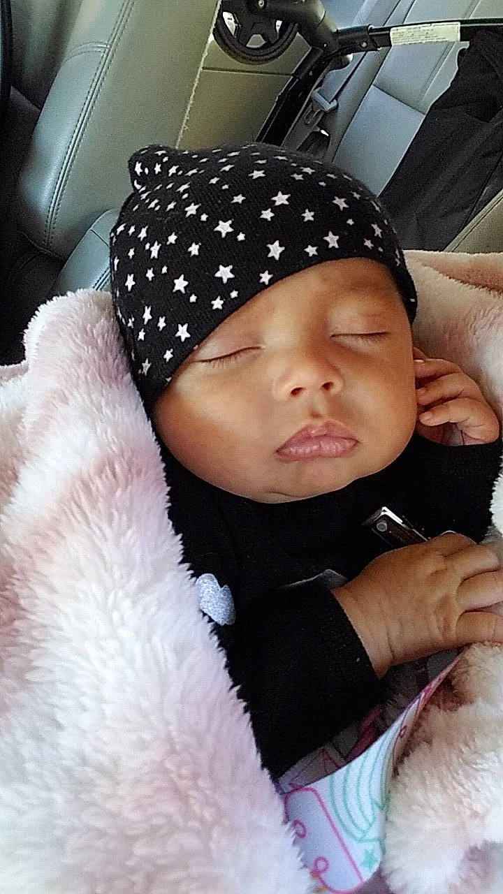 Lynda joined the competition — help win amazing prizes! baby, beanie, beauty, black_hair, bonnet, cap, cheek, child, cool, ear, fashion_accessory, forehead, hand, head, headgear, headwear, lip, nose, person, skin