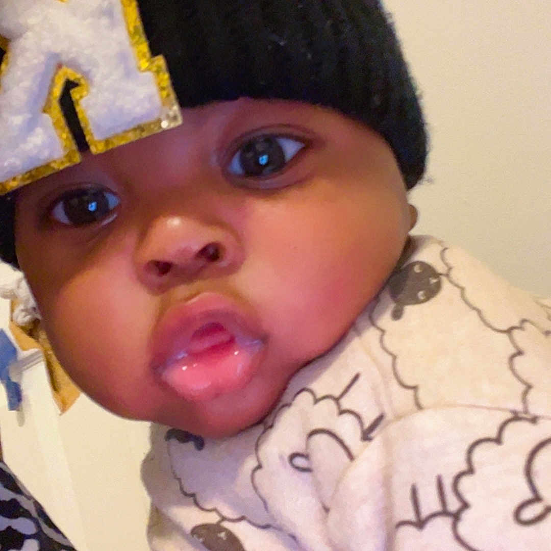 Kionjae is registered to the contest to win money with this photo: baby, child, face, hat, knit_hat, pout, curious, indoors, close_up, clothing, patterned_clothing, cute, wide_eyes, warm_clothing, infant, person, portrait, young_child, headwear, expression