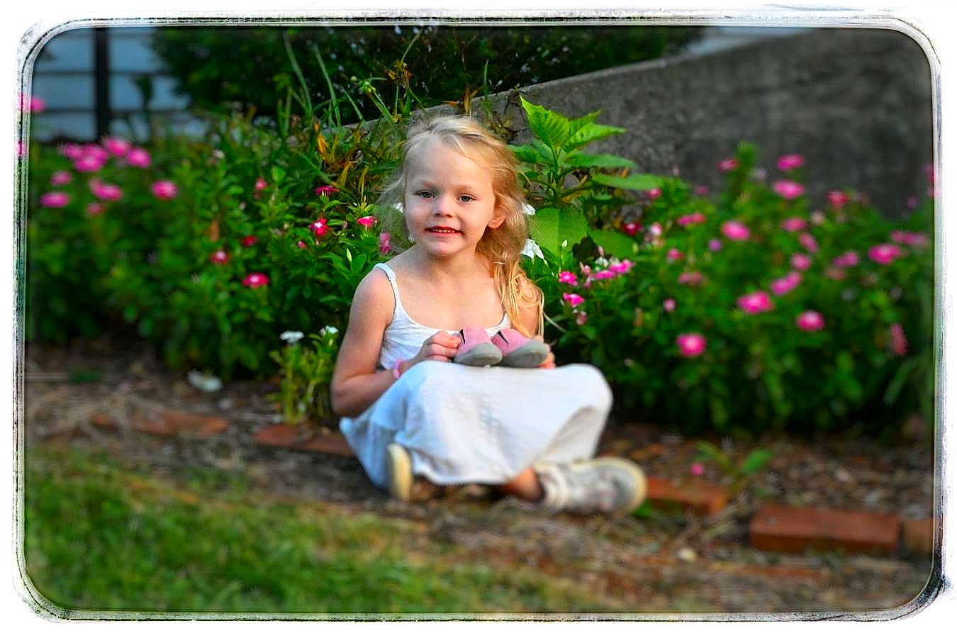 Chevelle joined the competition — help win amazing prizes! baby, beauty, electronic_device, flower, fun, grass, green, happy, joy, magenta, people_in_nature, person, petal, photograph, pink, plant, rectangle, sitting, sleeve, smile