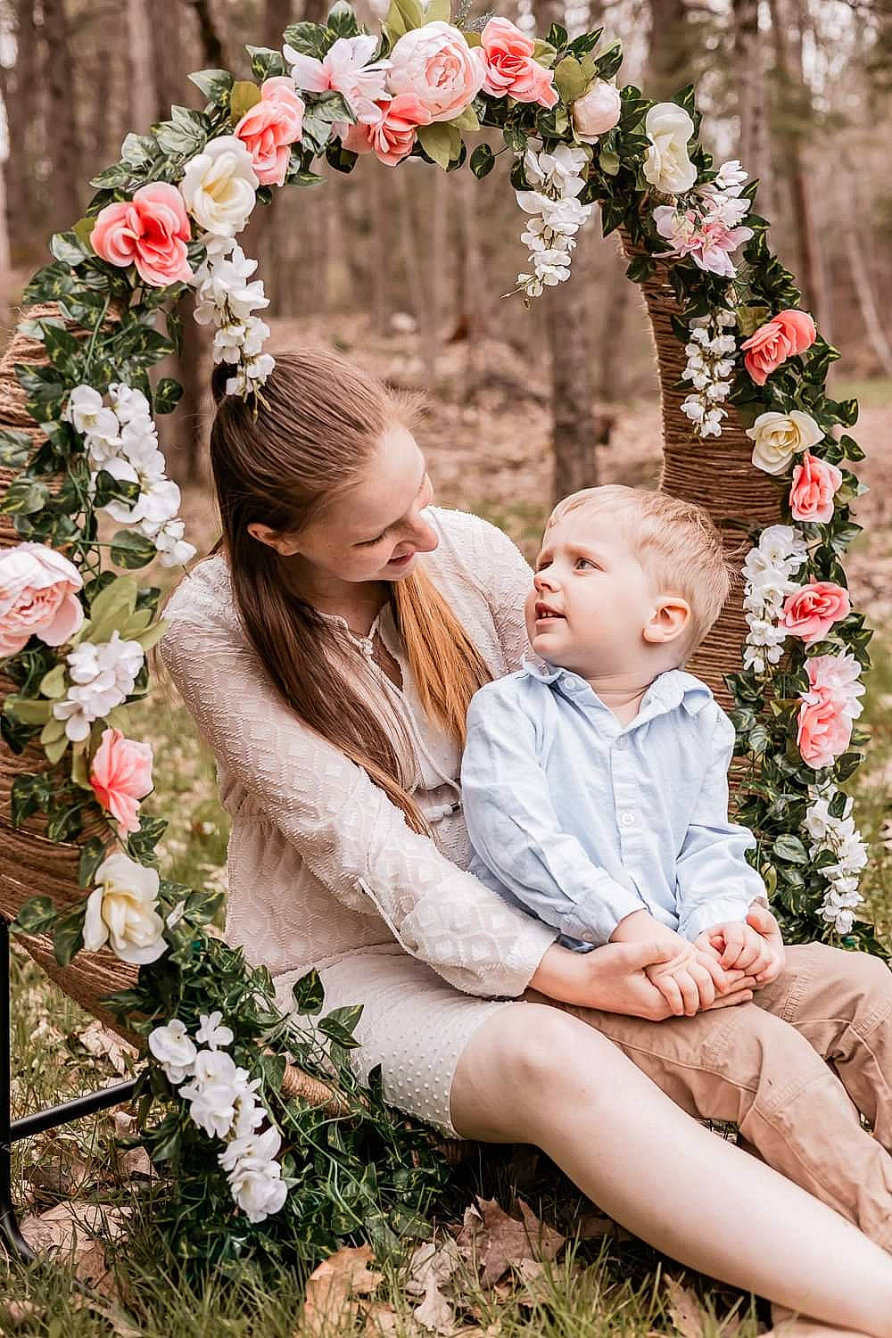 Remington is registered to the contest to win money with this photo: baby, bouquet, child, cut_flowers, event, face, flower, flower_arranging, grass, hair, hairstyle, happy, head, headpiece, jewellery, people_in_nature, person, petal, pink, plant