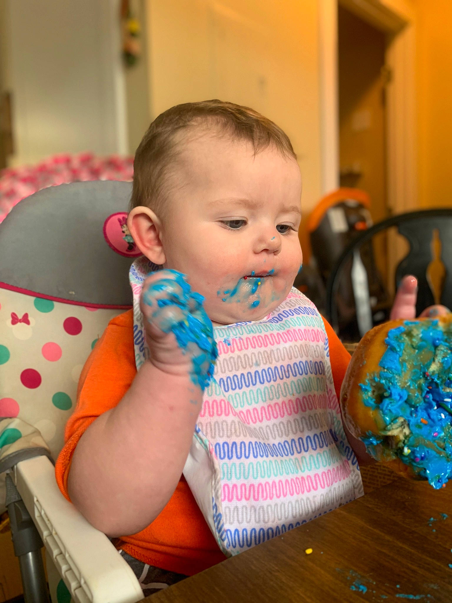 Jupiter is registered to the contest to win money with this photo: baby, baby_toddler_clothing, chair, child, comfort, drinkware, event, fun, happy, iris, jewellery, person, plate, room, sitting, skin, table, tableware, toddler, vacation