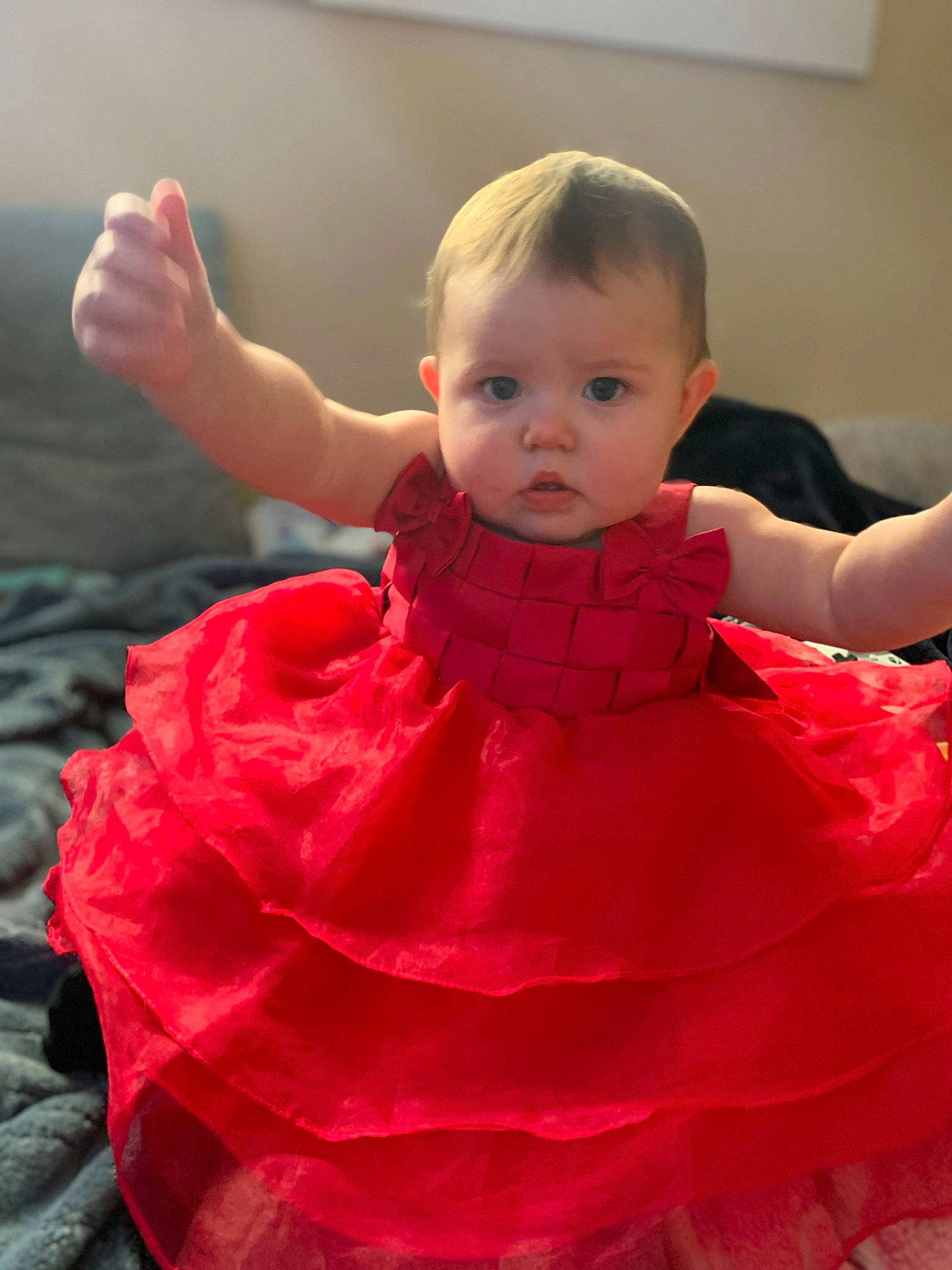 Jupiter is registered to the contest to win money with this photo: baby, baby_toddler_clothing, cheek, child, chin, dress, event, fun, gesture, happy, human_body, joint, lip, magenta, neck, one_piece_garment, person, pink, skin, sleeve