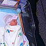 Kaia joined the competition — help win amazing prizes! newborn, baby, hospital, blanket, hat, sleeping, bassinet, mother, resting, couch, leopard_print, pillow, person, footwear, sneakers, indoors, quiet, peaceful, wrapped, tired