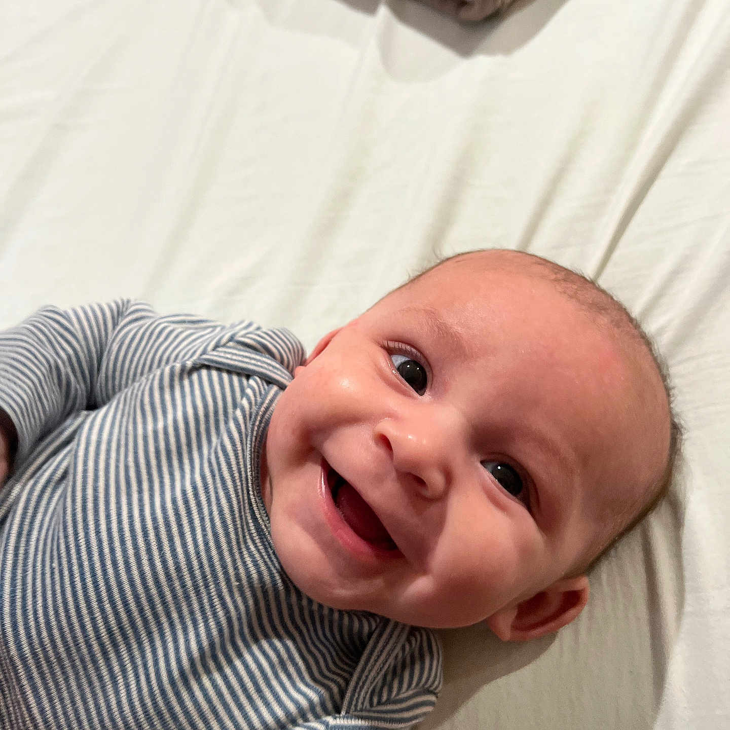 Jodee joined the competition — help win amazing prizes! baby, babylaughing, bodypart, clothing, face, finger, hand, happy, head, laughing, newborn, person, photography, portrait, shirt, smile