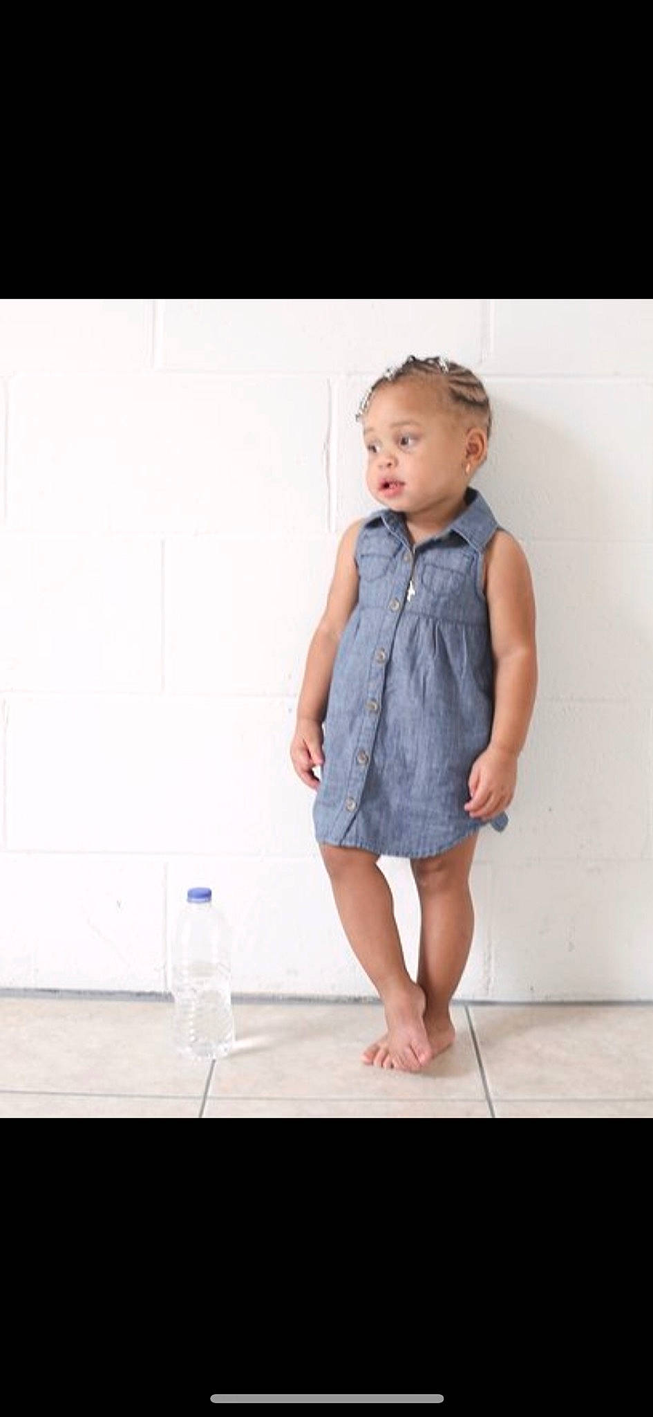 Khaliyah is registered to the contest to win money with this photo: baby, blue, child, child_model, clothing, denim, design, dress, footwear, jeans, one_piece_garment, outerwear, pattern, person, photography, shoe, sleeve, standing, textile, toddler