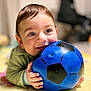 baby, ball, blue_ball, child, closeup, colorful, cute, face, floor, hands, happy, indoor, mat, person, playing, portrait, smiling, toddler, toy, young