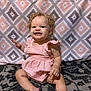 Kalia joined the competition — help win amazing prizes! toddler, child, smiling, curly_hair, pink_dress, sitting, carpet, patterned_background, indoor, happy, cute, person, portrait, baby, playful, young_child, fun, innocent, bright, cheerful