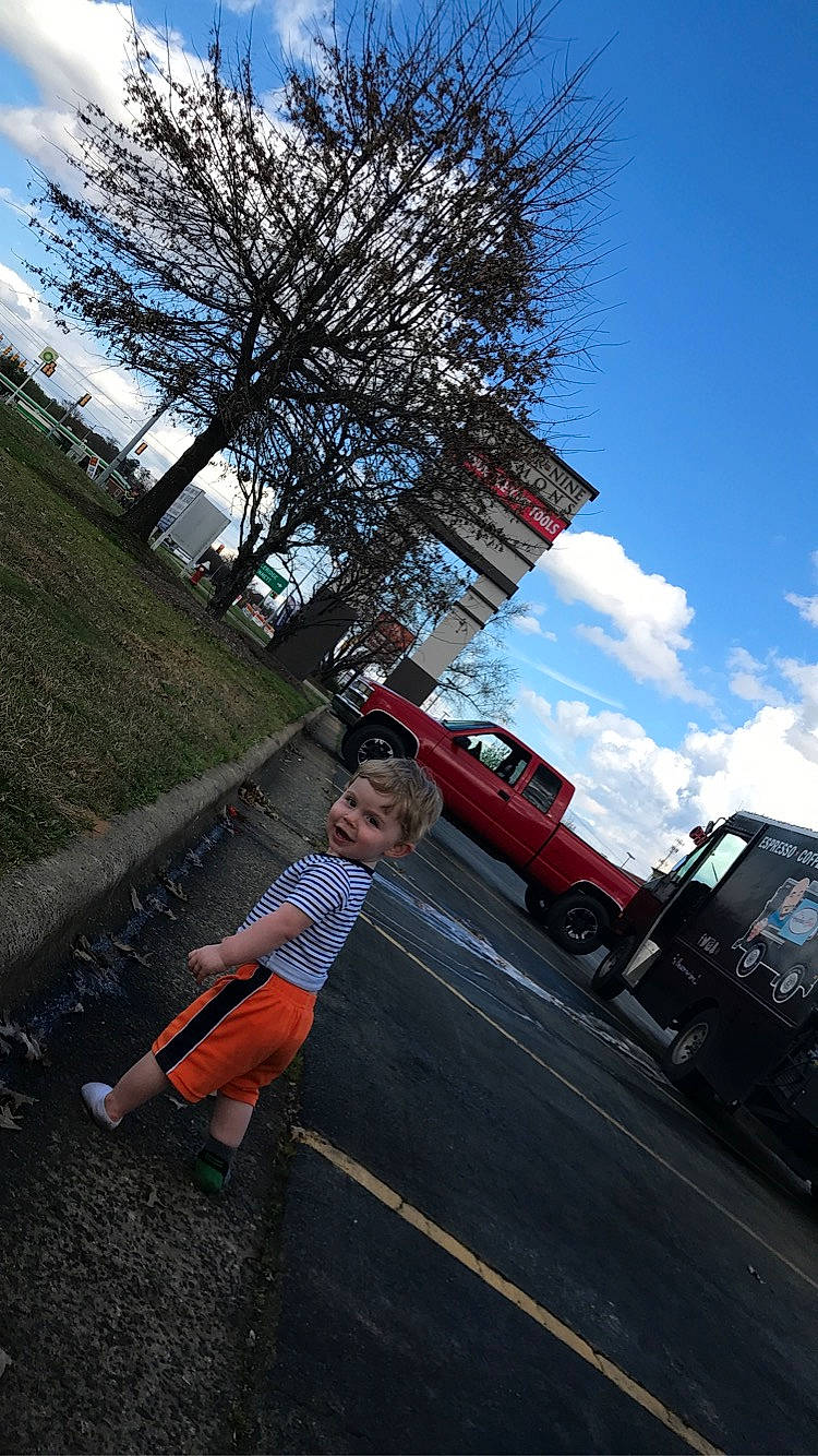 Christopher Jr is registered to the contest to win money with this photo: asphalt, car, person, photography, travel, tree, vehicle