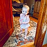 toddler, child, barefoot, dress, indoor, rug, wooden_door, carpet, bedroom, smiling, happy, person, home, furniture, cabinet, floor, door, wood, curtains, baby