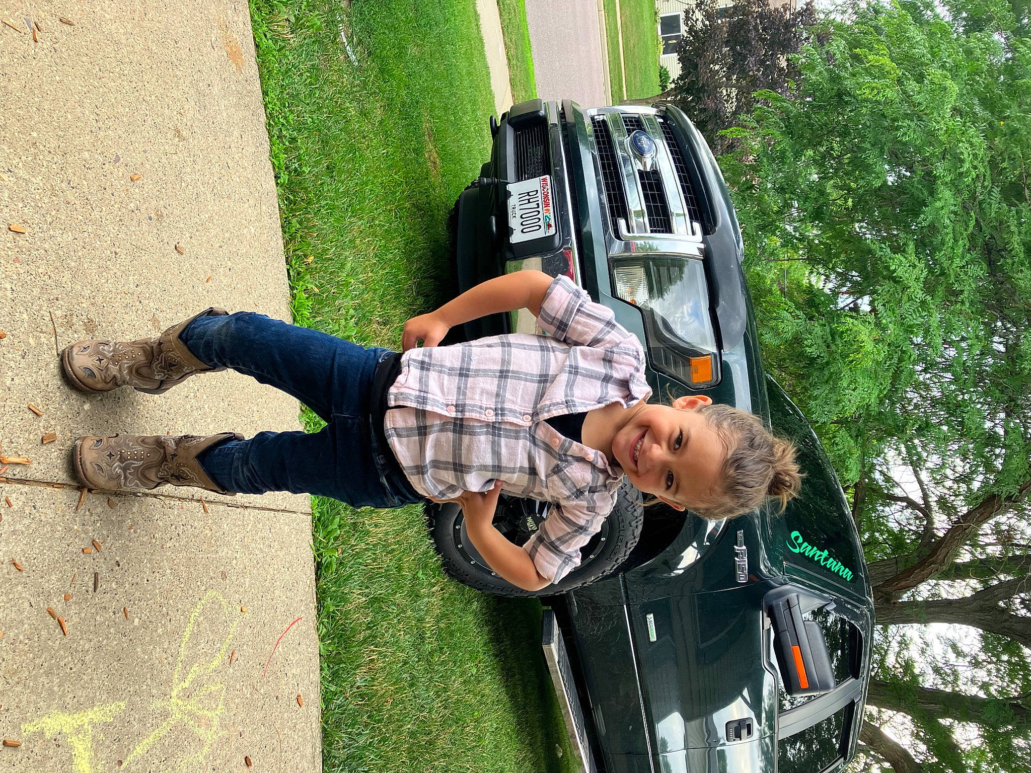 London is registered to the contest to win money with this photo: asphalt, auto_part, automotive_exterior, automotive_lighting, car, family_car, fun, grass, joy, leisure, luggage_and_bags, motor_vehicle, person, plant, recreation, rolling, tire, tree, vehicle, vehicle_door