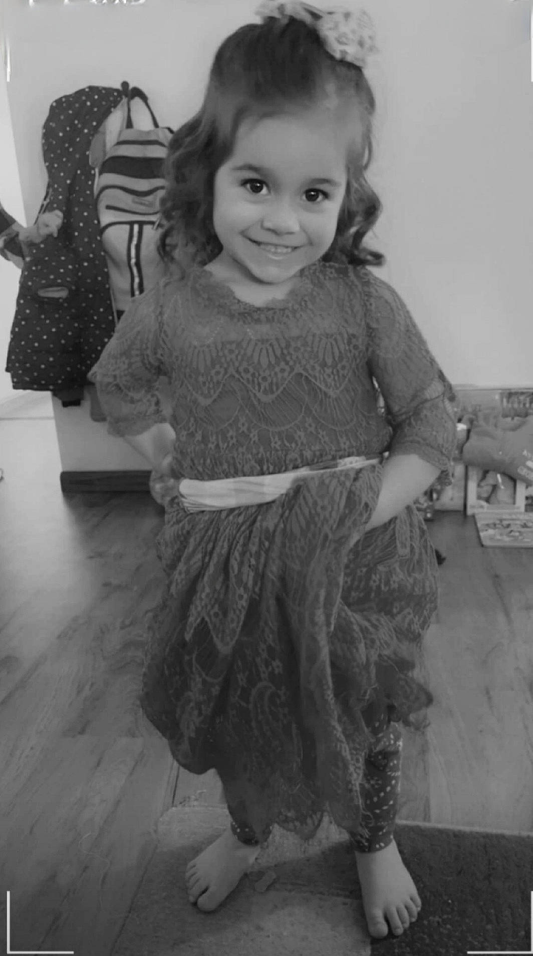 London joined the competition — help win amazing prizes! black, black_and_white, dress, eye, face, flash_photography, gesture, grey, hair, hairstyle, happy, human, iris, joy, person, photograph, sleeve, smile, standing, style