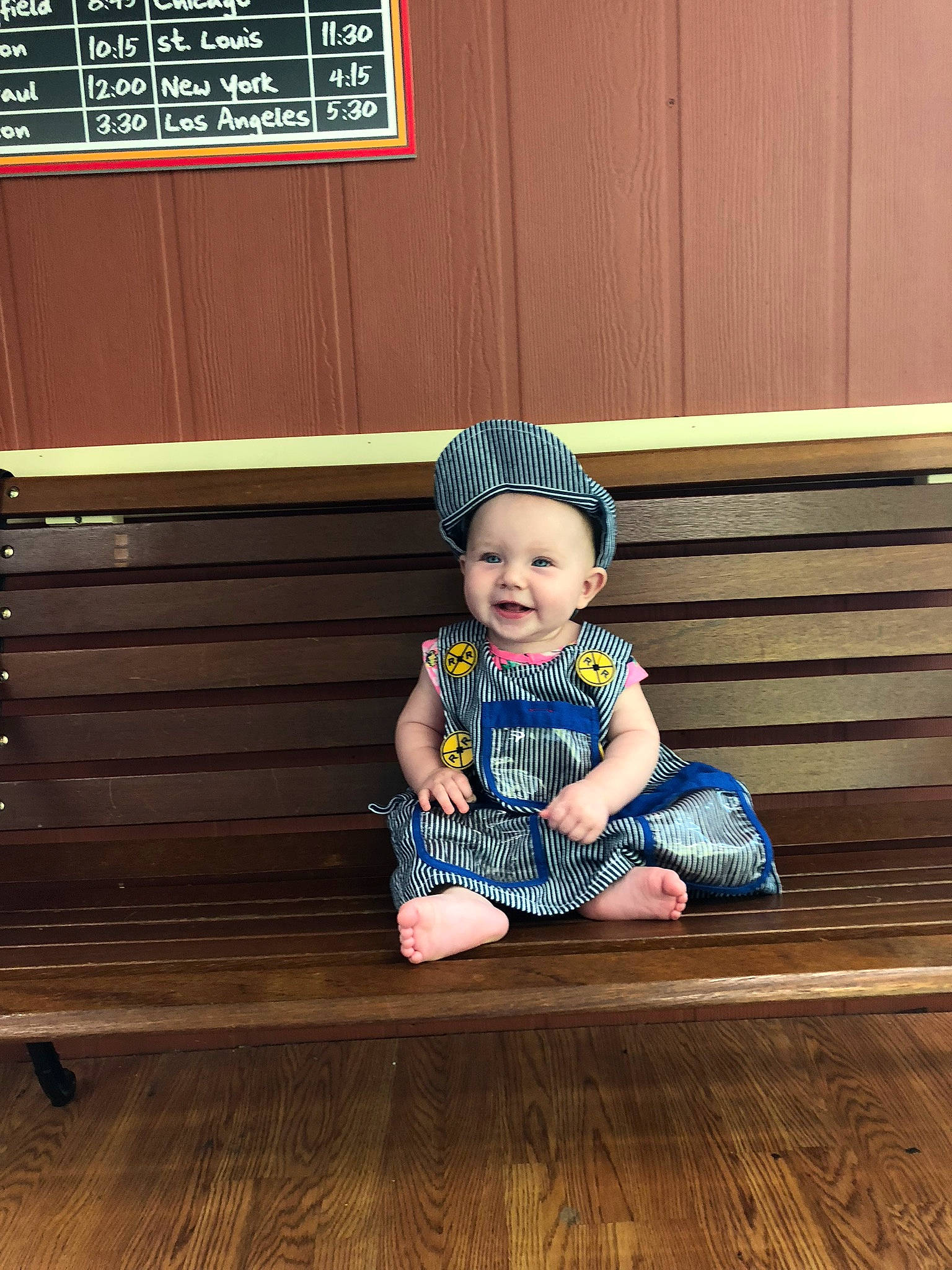 Daphne is registered to the contest to win money with this photo: child, day, floor, flooring, girl, headgear, person, play, product, sitting, toddler