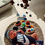 baby, sleeping, nike, onesie, hat, rug, knitted, toys, colorful, indoor, sunlight, window, soft, peaceful, child, infant, footwear, decorations, cushion, cozy