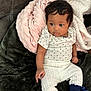 Alaiah joined the competition — help win amazing prizes! baby, blanket, blue_booties, child, clothing, couch, cozy, cute, hair, heart_pattern, indoor, infant, plush, portrait, sitting, skin, soft_texture, warm, white_pants, young_child