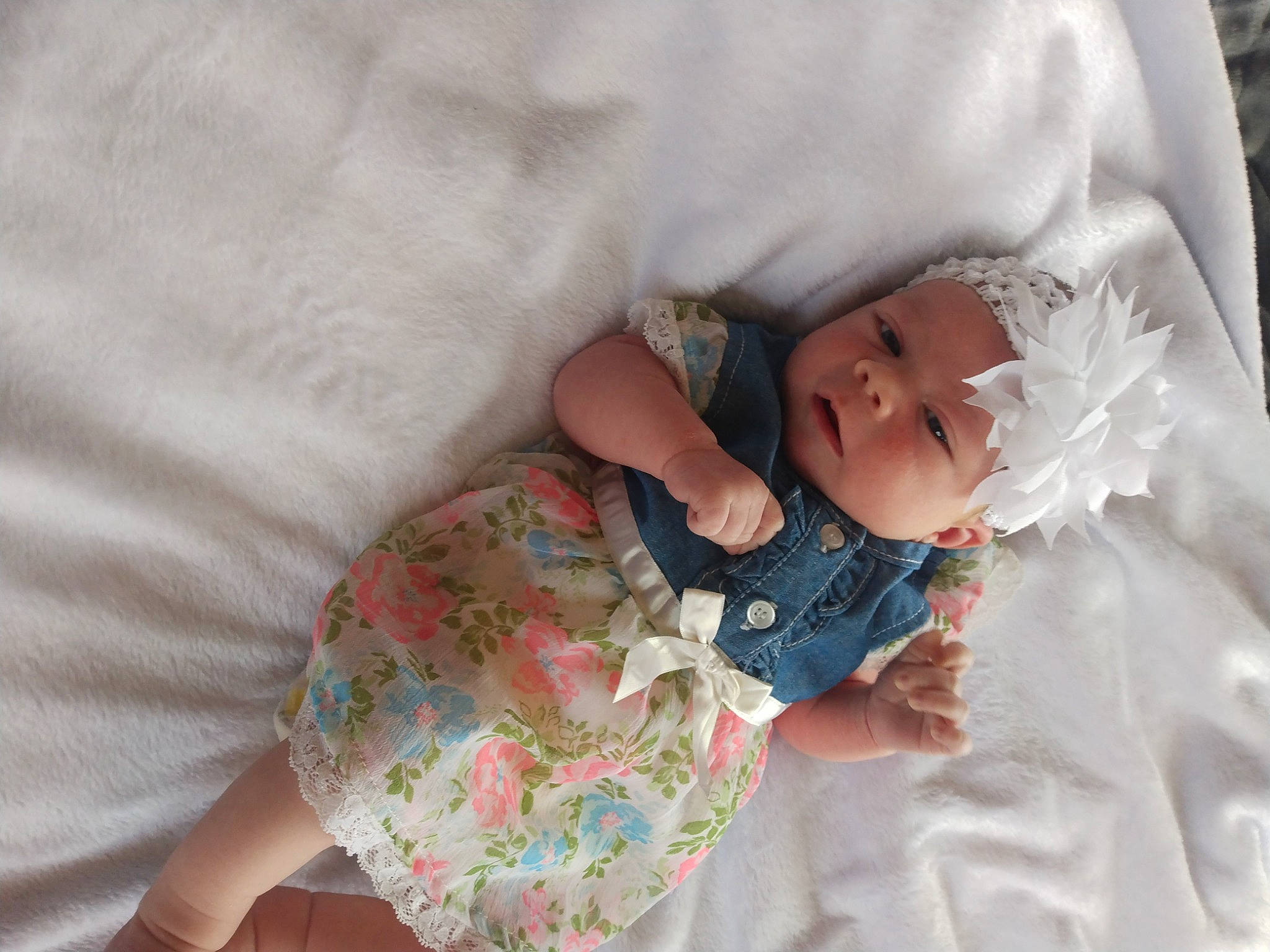 Sierra is registered to the contest to win money with this photo: baby, baby_products, baby_sleeping, baby_toddler_clothing, bedding, bedtime, cheek, child, comfort, eye, face, hand, head, headwear, human_body, linens, person, room, sitting, skin