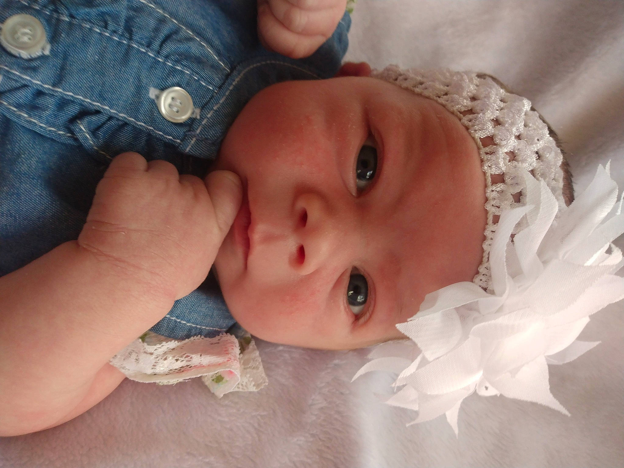 Sierra is registered to the contest to win money with this photo: arm, baby, baby_toddler_clothing, cheek, child, clothing, eyebrow, eyelash, finger, flash_photography, hand, happy, headgear, headwear, iris, lip, nose, organ, person, skin