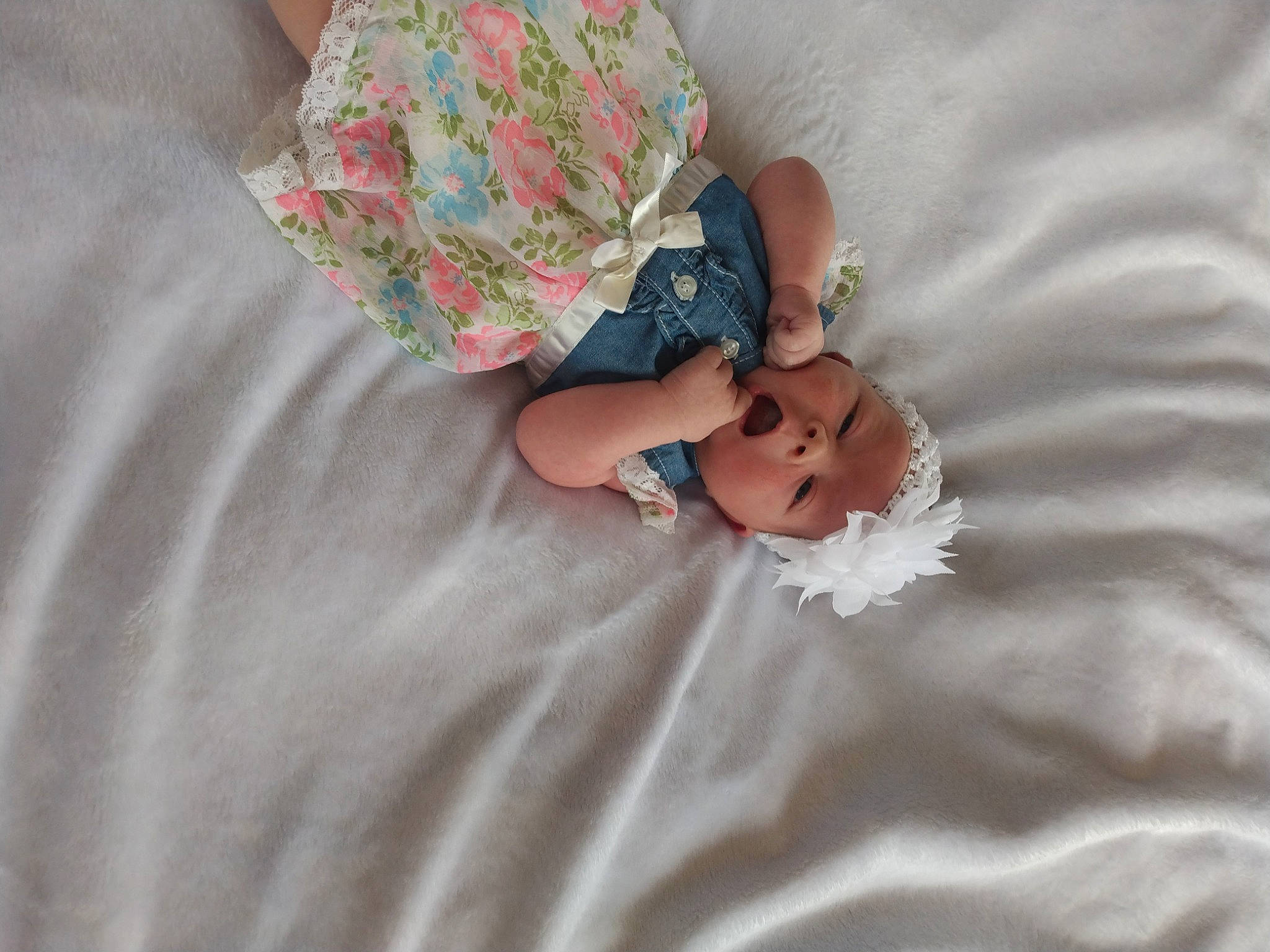 Sierra is registered to the contest to win money with this photo: baby, baby_products, baby_toddler_clothing, bedding, blanket, child, comfort, day_dress, embellishment, fashion_accessory, headwear, linens, nail, pattern, peach, person, petal, room, sleeve, thumb