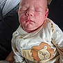 baby, sleeping, onesie, lion_print, infant, cute, soft_light, peaceful, child, face, portrait, clothing, newborn, skin, head, cute_outfit, indoors, closeup, person, resting