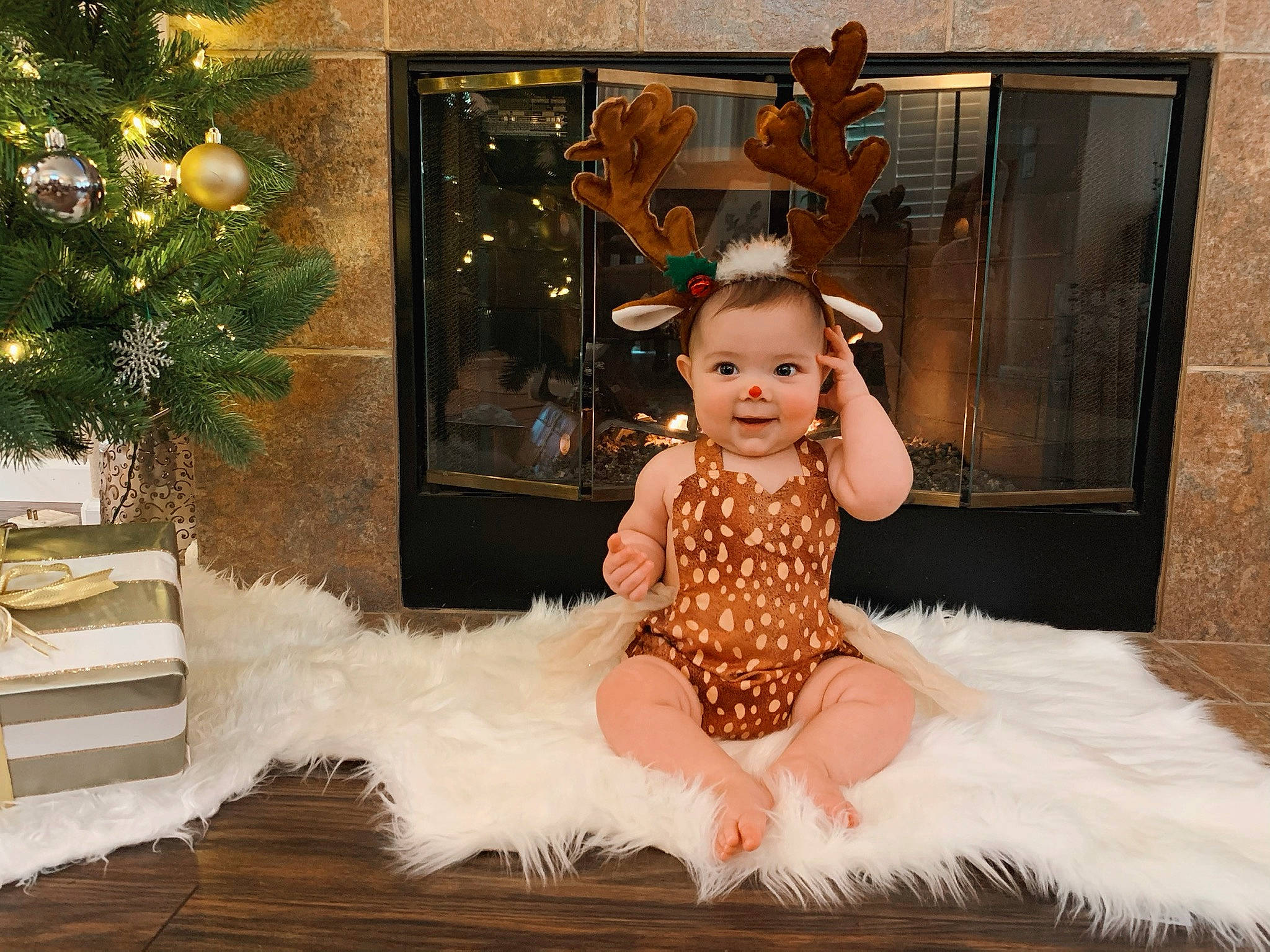 Elise is registered to the contest to win money with this photo: baby_toddler_clothing, ballet_tutu, beauty, christmas_tree, dress, event, fashion_design, fawn, fur, happy, headgear, headpiece, holiday, joy, ornament, peach, person, room, ruffle, toddler