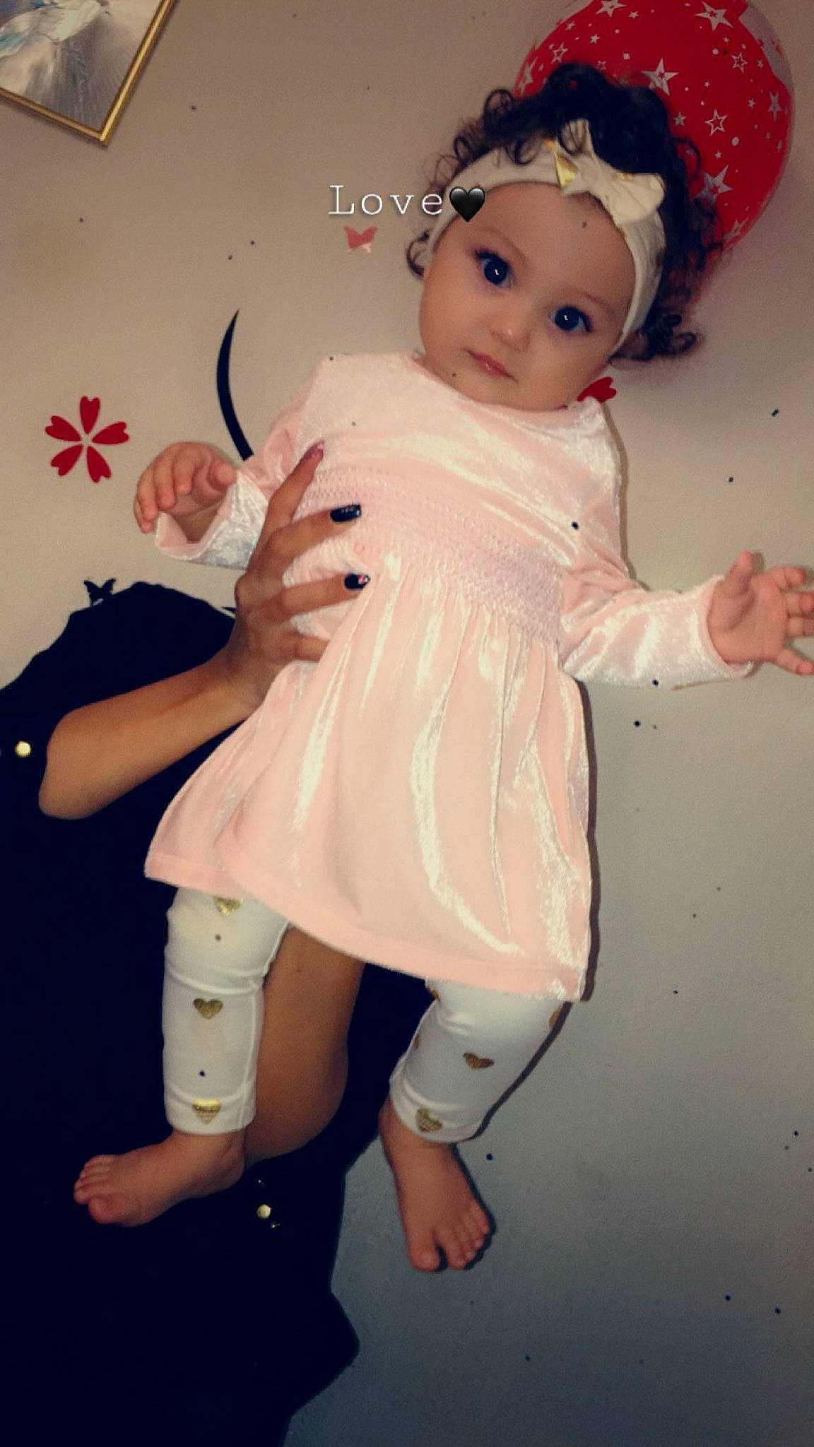Celline is registered to the contest to win money with this photo: baby_toddler_clothing, child, doll, facial_expression, fawn, finger, gesture, hairstyle, happy, head, headgear, headwear, leg, lip, person, pink, skin, sleeve, thumb, toy