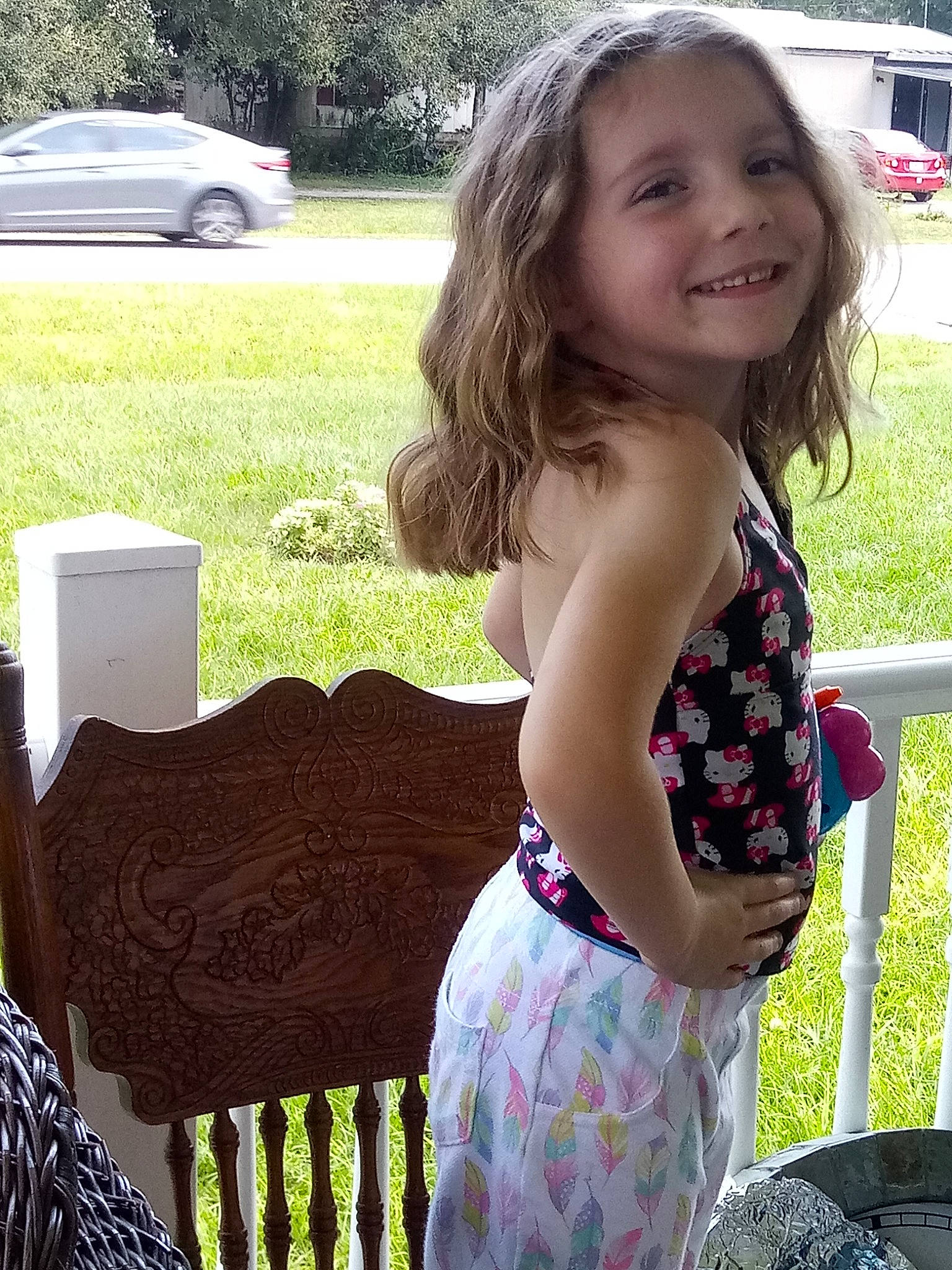 Jayme is registered to the contest to win money with this photo: baby_toddler_clothing, brown_hair, child, dress, grass, joy, long_hair, pattern, person, sitting, summer, toddler, vacation