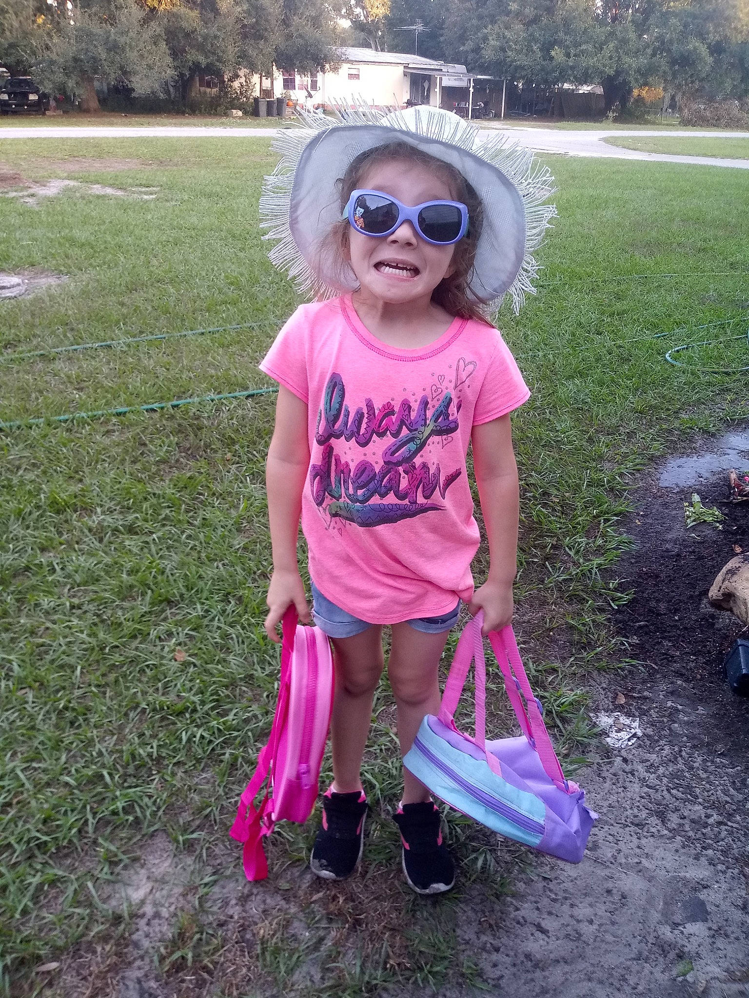 Jayme is registered to the contest to win money with this photo: child, cool, dress, eyewear, fun, glasses, grass, person, pink, plant, play, sunglasses, t_shirt, toddler, tree, vacation
