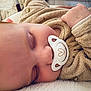 Lyanna participe au concours pour gagner de l'argent avec cette photo : baby, sleeping, pacifier, cozy, blanket, soft, infant, child, cute, face, hand, clothing, plush, rest, peaceful, indoors, closeup, comfort, adorable, nap