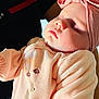 Lyanna participe au concours pour gagner de l'argent avec cette photo : baby, sleeping, infant, pink_clothing, headband, bow, soft_fabric, person_holding, close_up, peaceful, cute, child, portrait, indoor, face, toddler, warm_lighting, gentle, newborn, cozy