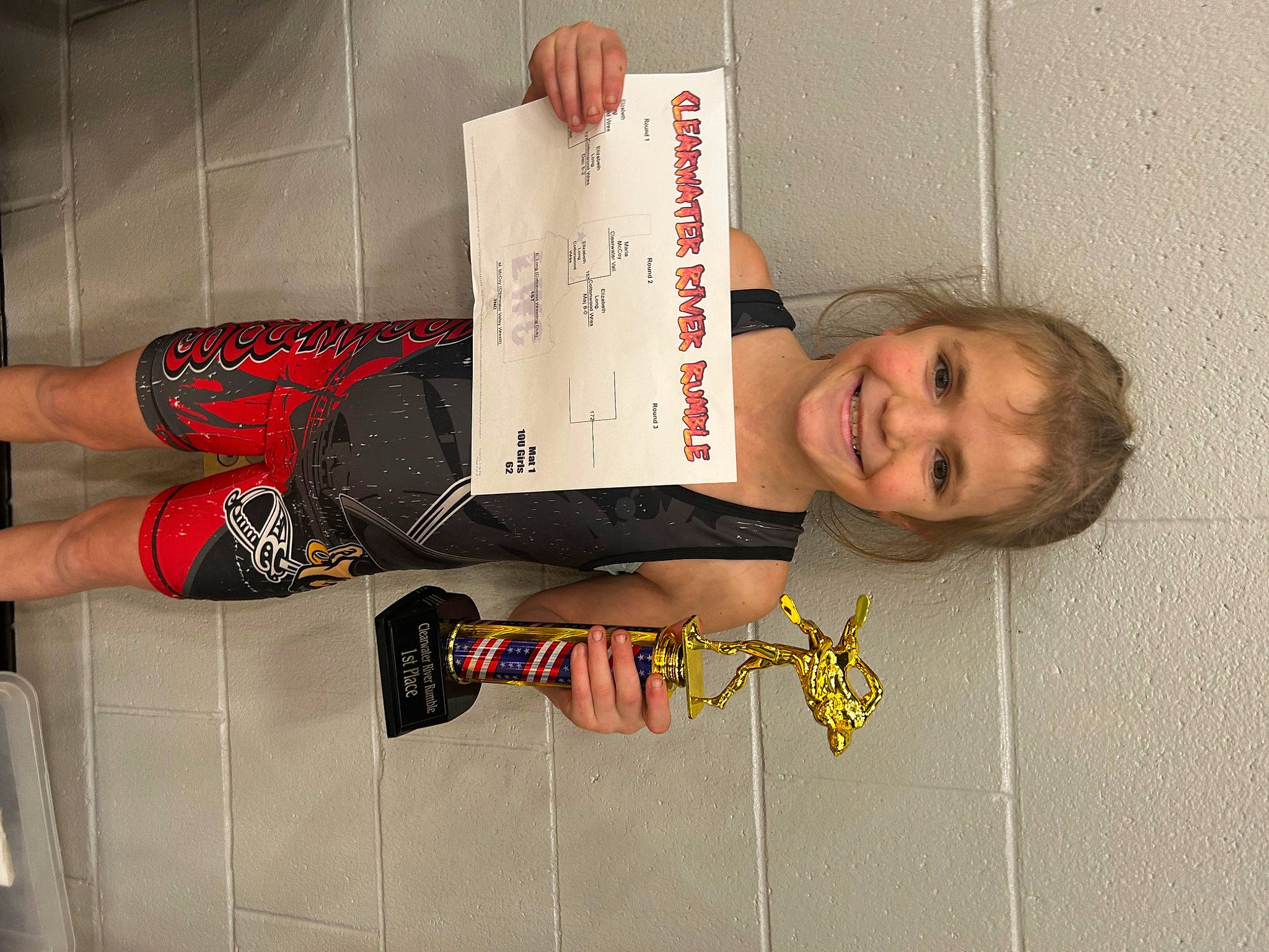 Elizabeth is registered to the contest to win money with this photo: carmine, child, elbow, flooring, font, foot, fun, handwriting, human_leg, joy, knee, pattern, person, room, smile, sportswear, thigh, toddler, waist, wrist