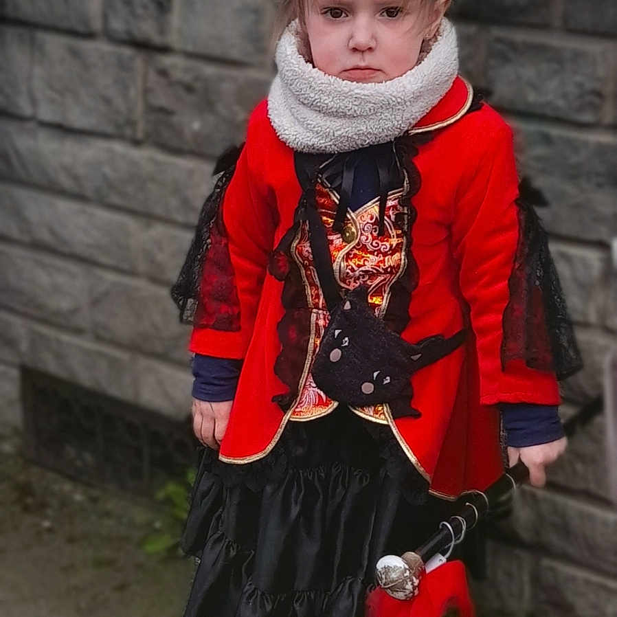 Myla participe au concours pour gagner de l'argent avec cette photo : bicycle, child, clothing, coat, costume, dress, face, female, footwear, girl, head, jacket, knitwear, people, person, photography, portrait, scarf, shoe, sweater