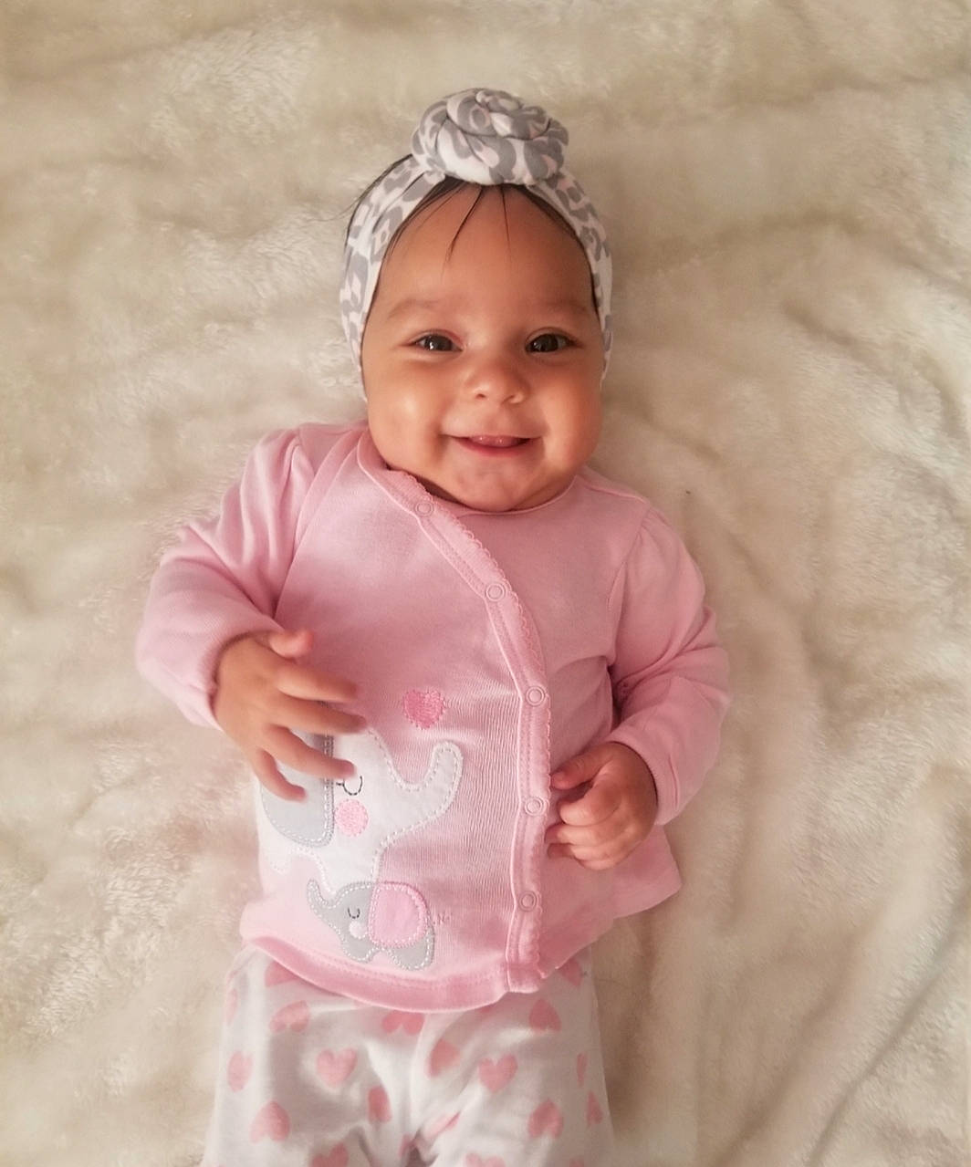 Aaliyah is registered to the contest to win money with this photo: baby, baby_toddler_clothing, child, hair_accessory, headband, headgear, headpiece, headwear, joy, person, pink, product, smile, toddler