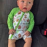 Colton joined the competition — help win amazing prizes! animal_print, baby, barefoot, car_seat, child, clothing, curious, cute, expression, face, green_sleeves, hands, indoors, infant, legs, portrait, romper, seatbelt_buckle, sitting, skin