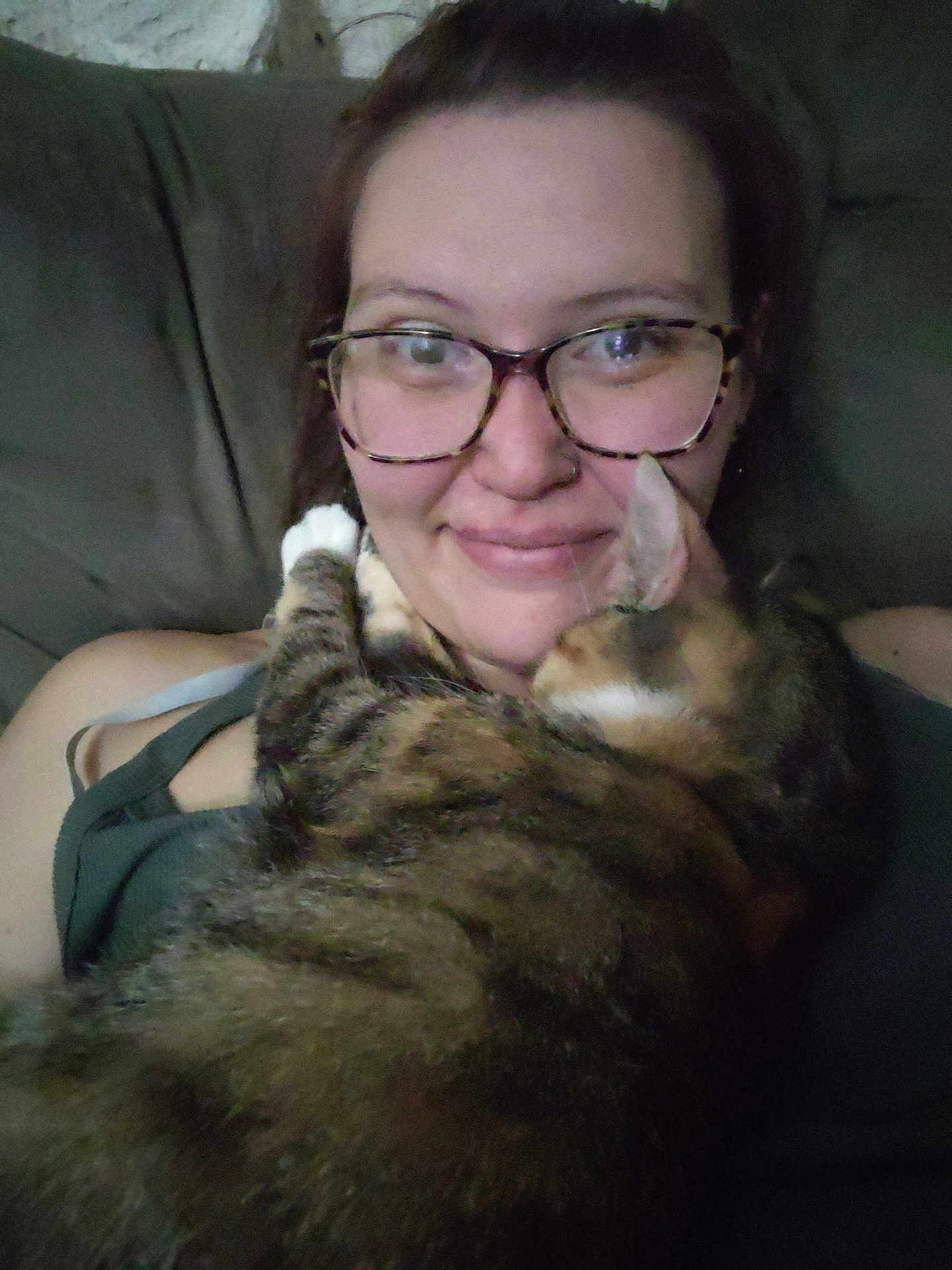 Sophie joined the competition — help win amazing prizes! person, cat, glasses, smile, couch, indoor, pet, tabby_cat, affection, closeup, casual, comfort, relaxation, hair, skin, clothing, face, feline, friendship, love