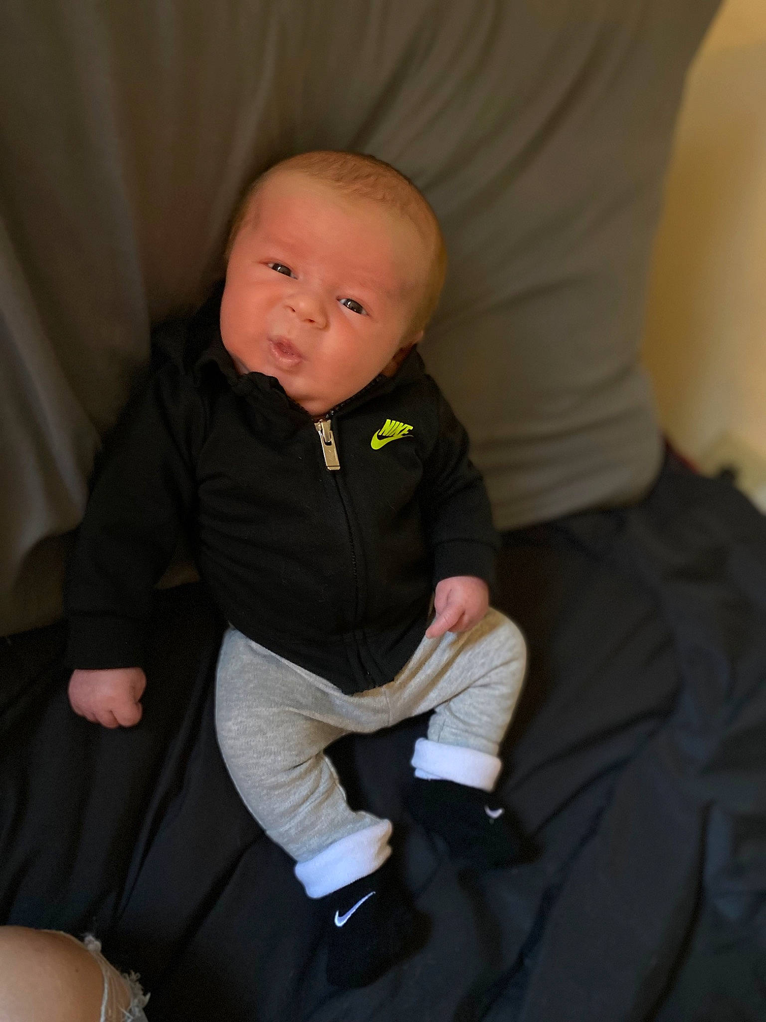Jaxxton joined the competition — help win amazing prizes! baby, baby_toddler_clothing, cheek, child, comfort, elbow, finger, flooring, human_leg, knee, lap, leg, person, sitting, skin, sleeve, sock, t_shirt, thigh, toddler