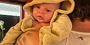 Peter joined the competition — help win amazing prizes! baby, child, costume, lion, hood, animal_costume, cute, tattoo, shoulder, adult, person, indoors, window, warm_lighting, face, clothing, hat, portrait, expression, skin