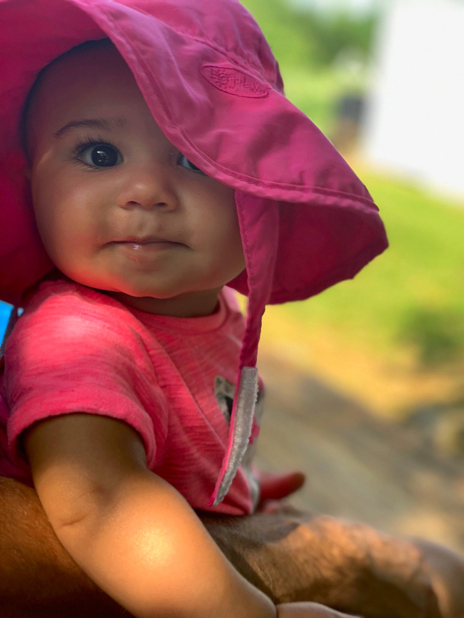 Willow Emory is registered to the contest to win money with this photo: adaptation, baby, cheek, child, eye, face, fun, happy, headgear, human, lip, magenta, person, pink, skin, smile, sun_hat, toddler