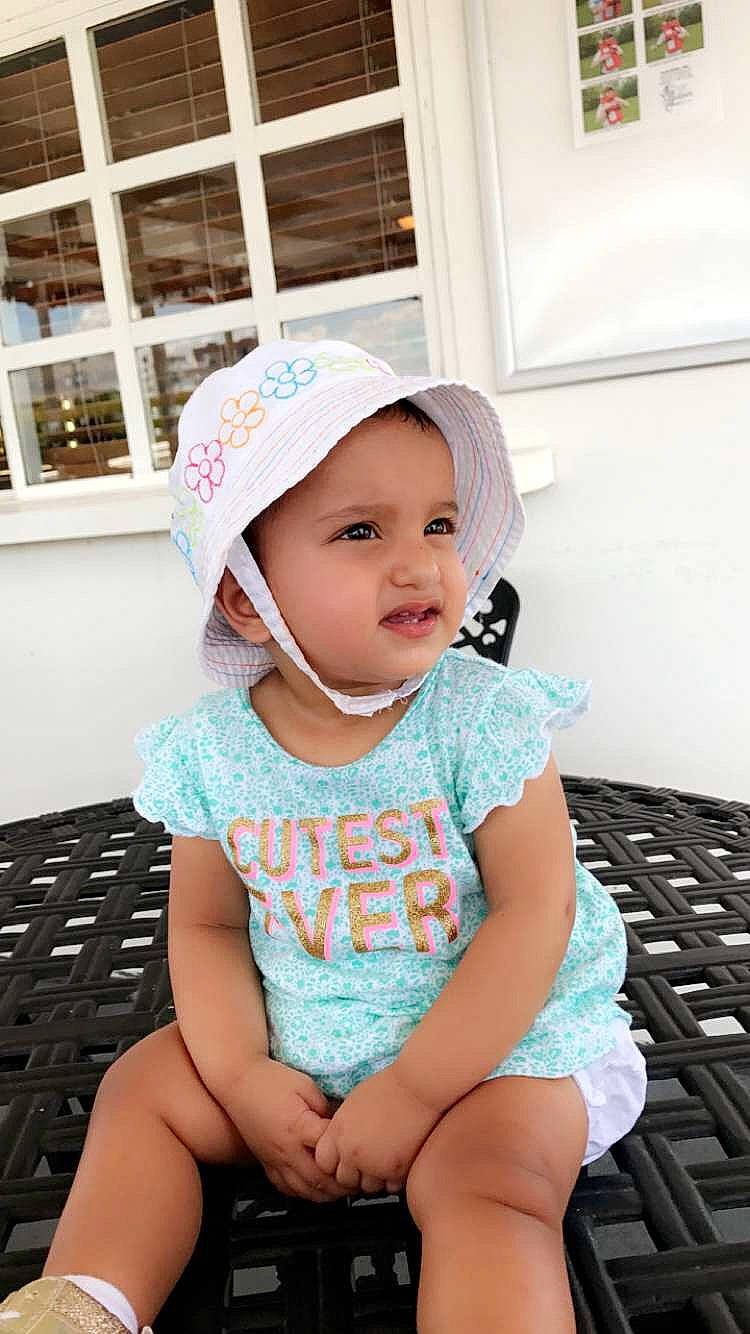 Layan joined the competition — help win amazing prizes! baby, baby_toddler_clothing, baseball_cap, cap, child, computer_keyboard, electric_blue, fashion_accessory, happy, headgear, headwear, input_device, leisure, office_equipment, office_supplies, pattern, peripheral, person, pink, sleeve