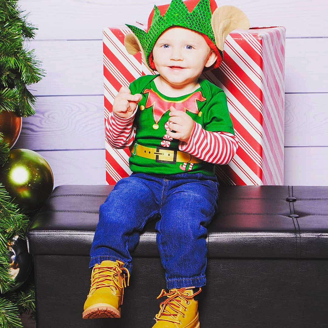 Roland is registered to the contest to win money with this photo: child, christmas, costume, fictional_character, headgear, headwear, holiday, person, product, toddler