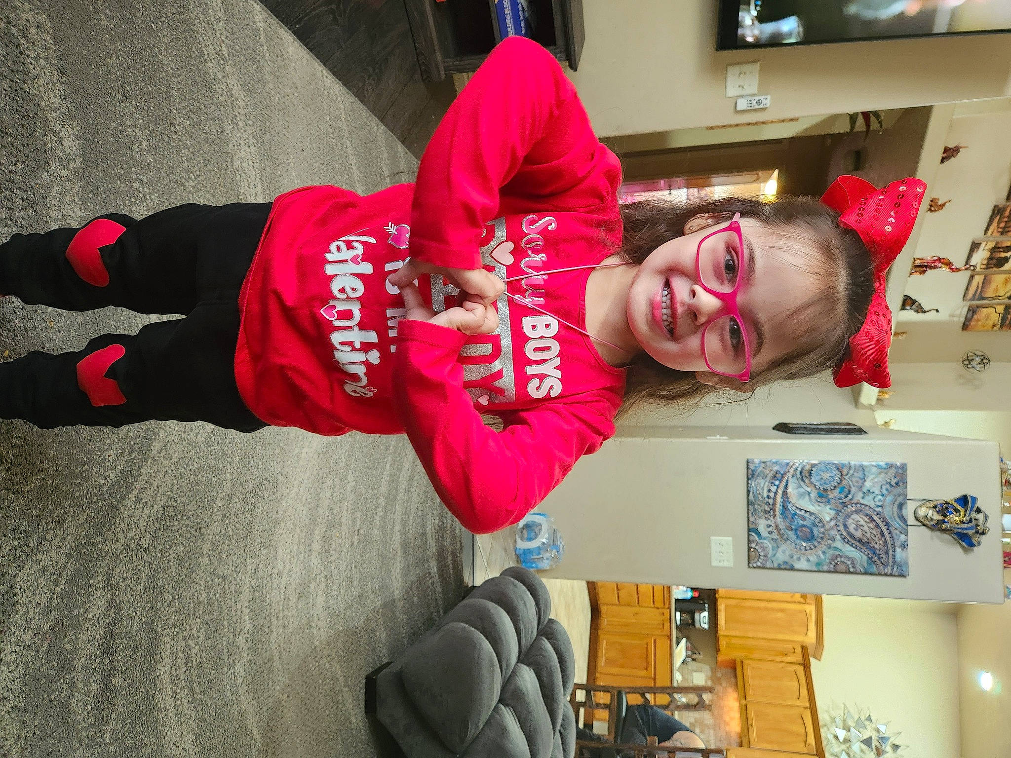 Charlize joined the competition — help win amazing prizes! carmine, child, costume, display_device, event, eyewear, fun, happy, human_leg, joy, led_backlit_lcd_display, person, picture_frame, room, sleeve, smile, sportswear, t_shirt, television