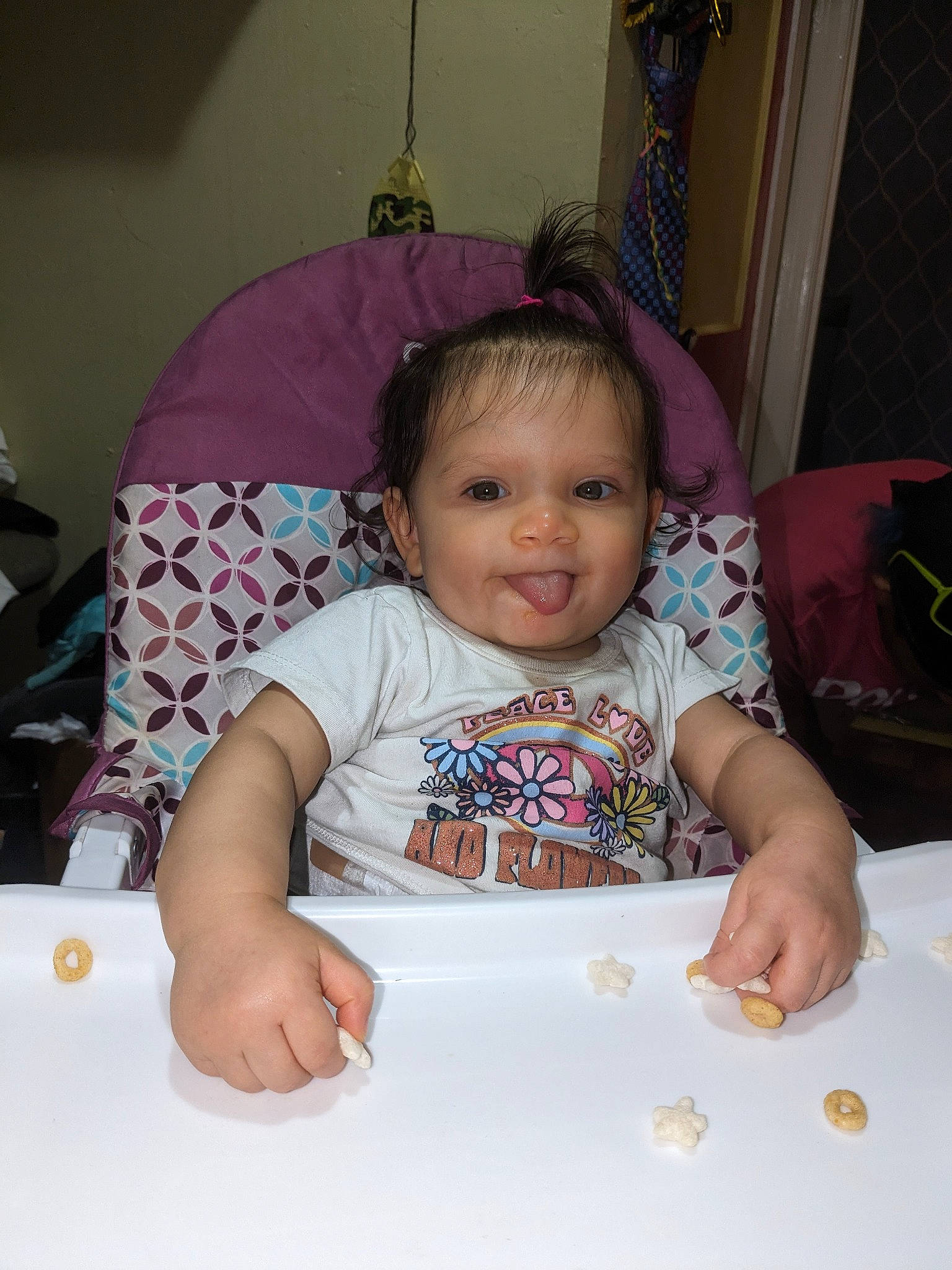 Emiliana is registered to the contest to win money with this photo: baby, baby_products, baby_toddler_clothing, bib, cheek, child, comfort_food, dishware, finger, fun, happy, head, linens, person, sitting, skin, sleeve, smile, sweetness, t_shirt