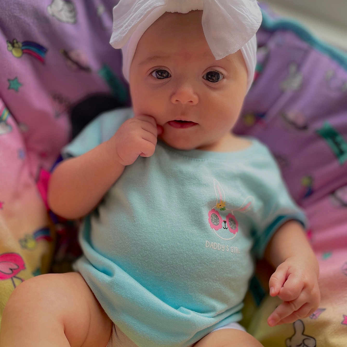 Emerson joined the competition — help win amazing prizes! baby, bed, bodypart, bonnet, cap, clothing, couch, cushion, diaper, face, finger, furniture, hand, hat, head, newborn, person, photography, portrait, sitting