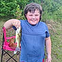 Malachi is registered to the contest to win money with this photo: animal, blue_shirt, boy, catch, chair, child, dog, fish, fishing, grass, happy, nature, outdoor, pet, portrait, recreation, red_shorts, smiling, summer, trees