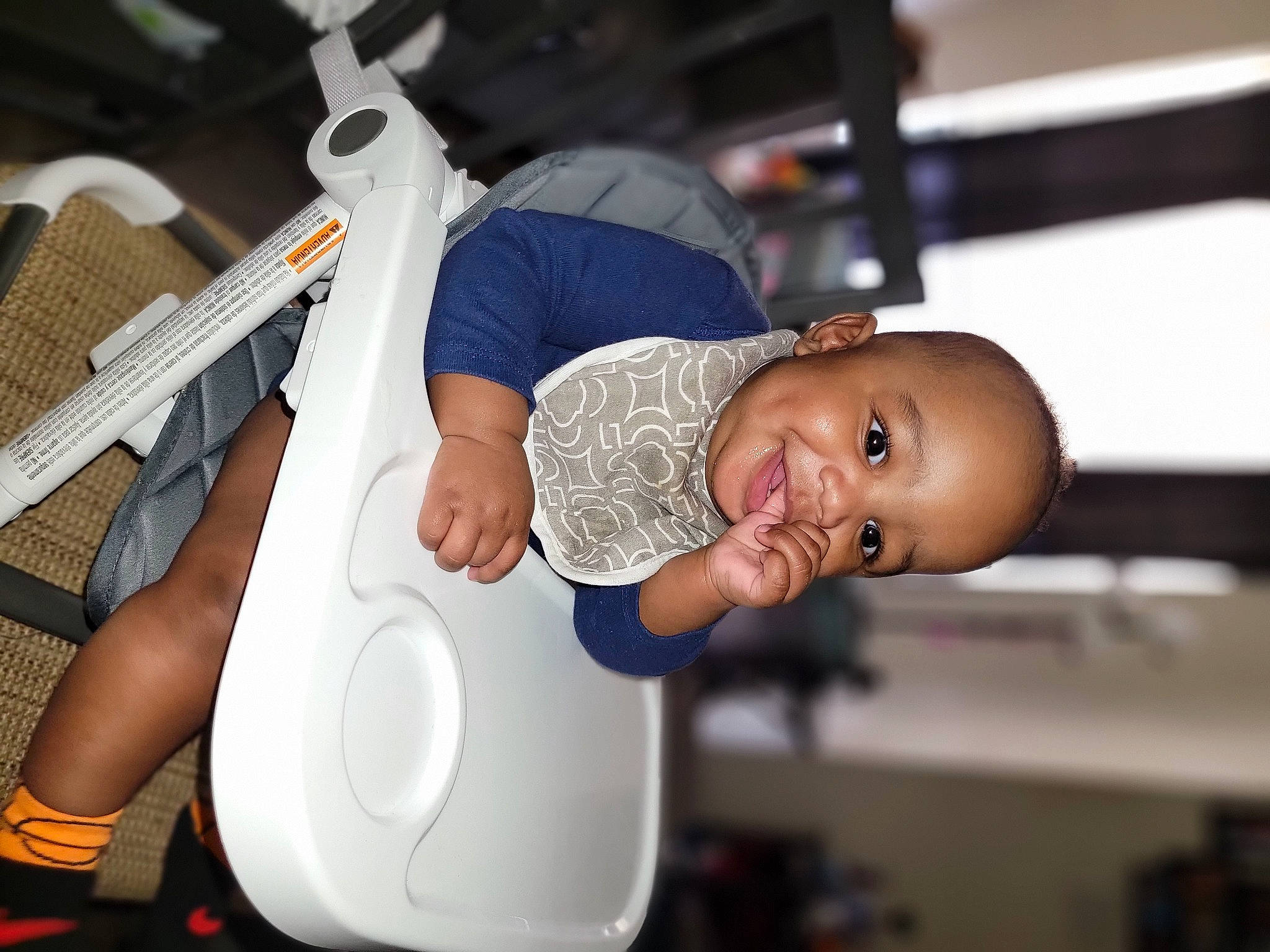 Kendrick is registered to the contest to win money with this photo: baby, baby_products, baby_safety, baby_toddler_clothing, child, comfort, elbow, event, fun, hat, health_care, home_appliance, joy, person, room, service, smile, t_shirt, toddler
