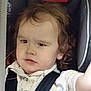 Oaklan joined the competition — help win amazing prizes! child, toddler, car_seat, curly_hair, seatbelt, shirt, patterned_clothing, indoor, vehicle, safety, young_child, person, portrait, baby, travel, car_interior, seat, restraint, serious_expression, young_kid