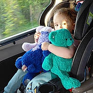 Oaklan joined the competition — help win amazing prizes! child, toddler, car_seat, stuffed_toy, blue_bear, green_bear, window, car_interior, sunlight, plush_toy, childrens_clothing, pants, seatbelt, travel, road_trip, nature, trees, daylight, cute, happy