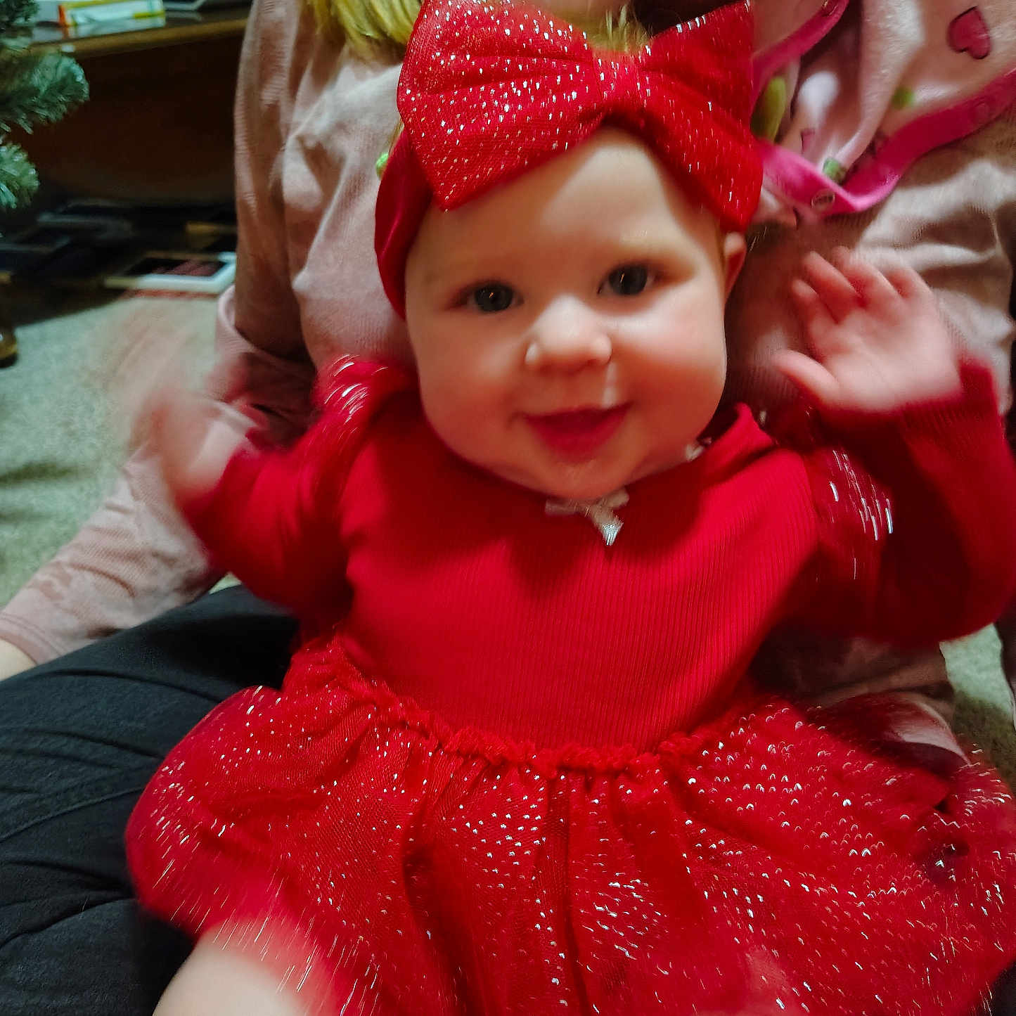 Olivia is registered to the contest to win money with this photo: accessories, baby, bodypart, bonnet, cap, clothing, couch, dress, face, finger, formalwear, furniture, hand, happy, hat, head, person, photography, portrait, smile
