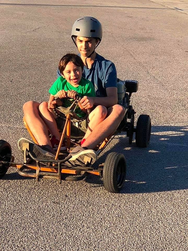 Ian joined the competition — help win amazing prizes! automotive_design, automotive_tire, automotive_wheel_system, blue, face, fun, grass, head, headwear, helmet, human, joy, leg, mode_of_transport, motor_vehicle, nature, person, product, recreation, sports_equipment