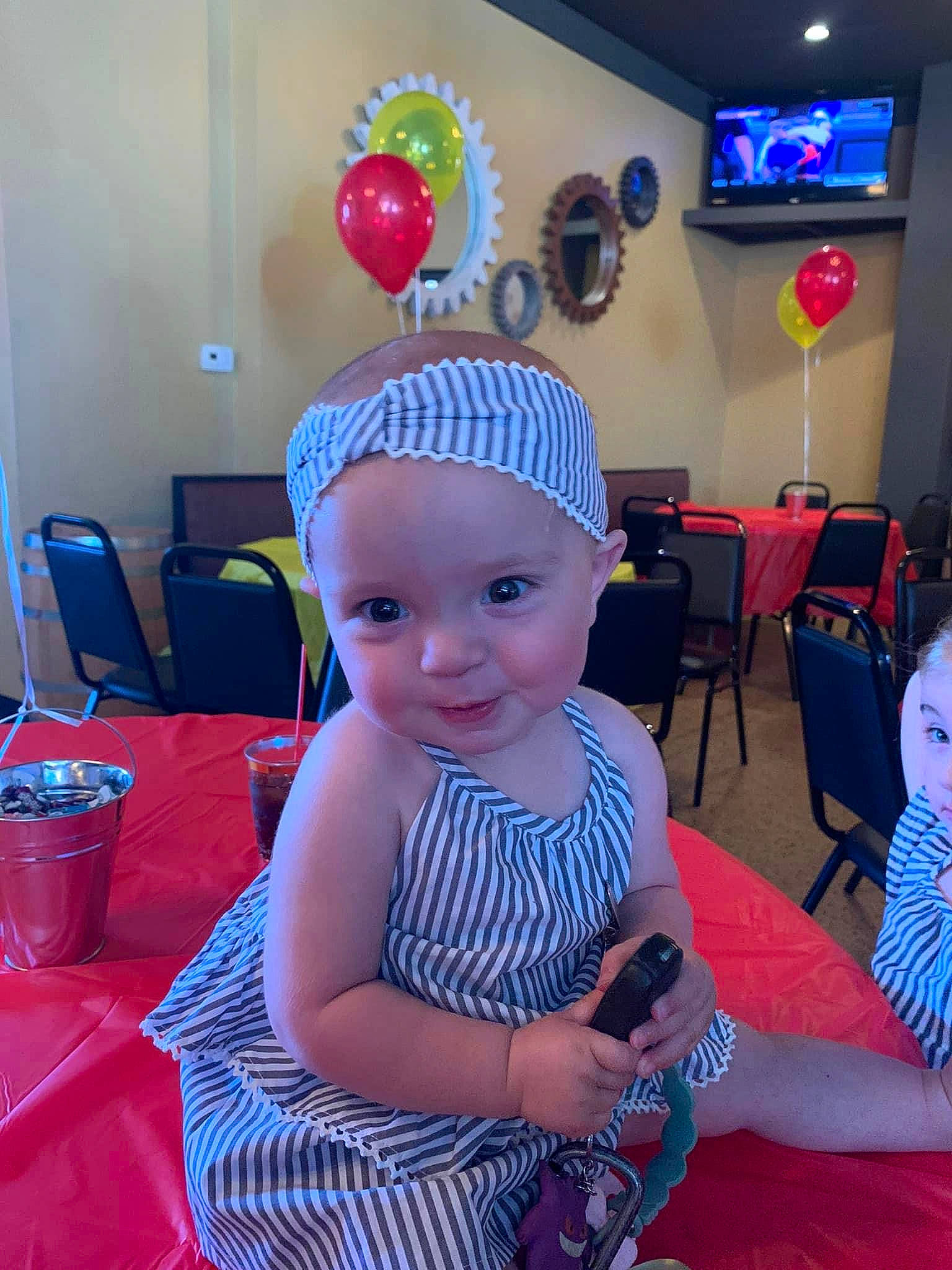 Emilia joined the competition — help win amazing prizes! baby, baby_toddler_clothing, balloon, birthday, blue, chair, child, costume_hat, event, fun, happy, hat, headwear, leisure, party, party_hat, party_supply, person, pink, smile