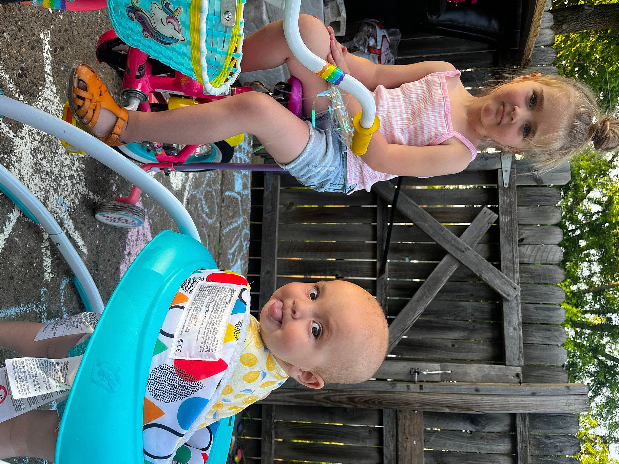 Emilia is registered to the contest to win money with this photo: baby_toddler_clothing, beauty, child, face, fun, green, happy, joy, leisure, person, photograph, pink, plant, product, shorts, snapshot, summer, tire, toddler, tree